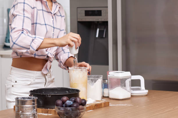 istock baker woman preparing pie in modern kitchen 1919751422