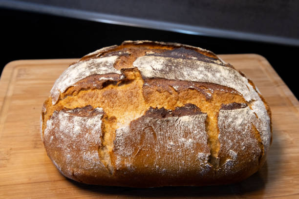 istock freshly baked bread on wooden board 1919767829