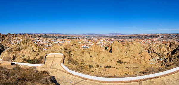 Mirador Cerro de la Bala, to enjoy beautiful landscapes on Guadix, a city in the inland of the Granada province famous for the houses carved in tuff rocks and evocative landscapes (6 shots stitched)