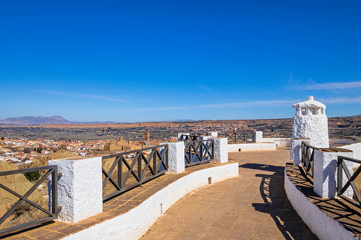 Mirador Cerro de la Bala, to enjoy beautiful views on Guadix, a city in the inland of the Granada province famous for the houses carved in tuff rocks, the white chimney emerging from the ground and the evocative landscapes