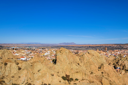 View on Guadix, a city in the inland of the Granada province famous for the inhabited houses carved in tuff rocks