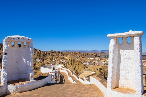 Mirador Cerro de la Bala, to enjoy beautiful views on Guadix, a city in the inland of the Granada province famous for the houses carved in tuff rocks, the white chimney emerging from the ground and the evocative landscapes