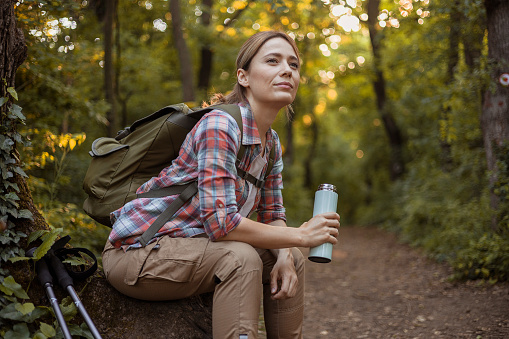 Tired Female Hiker Taking a Break During Holiday Vacation Trip