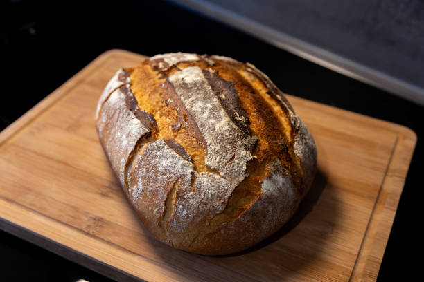 istock freshly baked bread on wooden board 1919796824