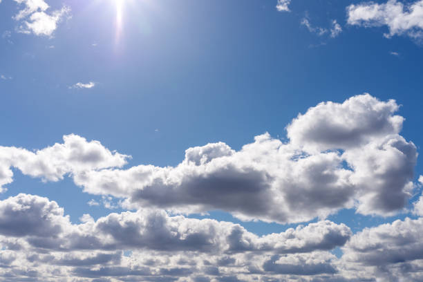 Blue sky background with white clouds.Cloudscape. Sunny day. Cumulus white cloud.
