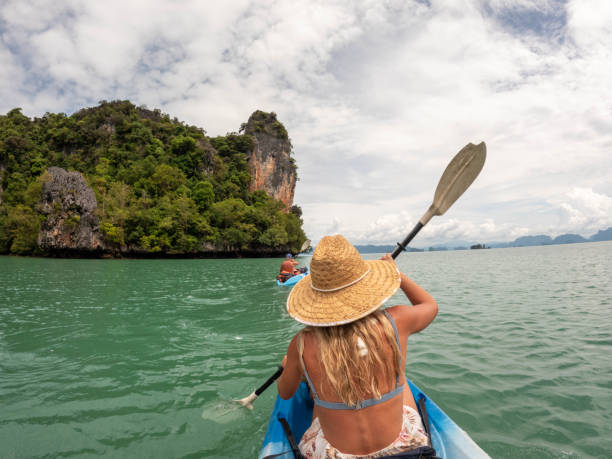 istock Family kayaking in tropical setting 1919812306