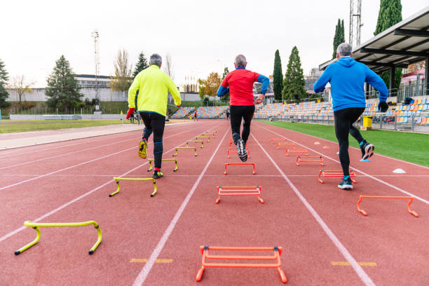 istock Rear View of Senior Athletes in Agility Training on Track 1919834201