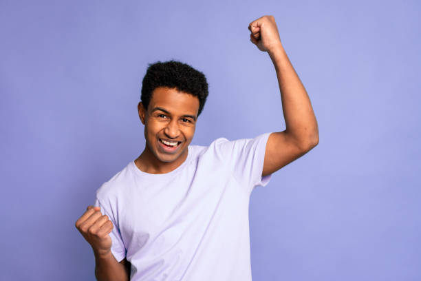 istock Young Man Celebrating with Joyful Gesture 1919863852