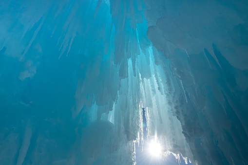 Ice castle tunnel with bright sunlight shining