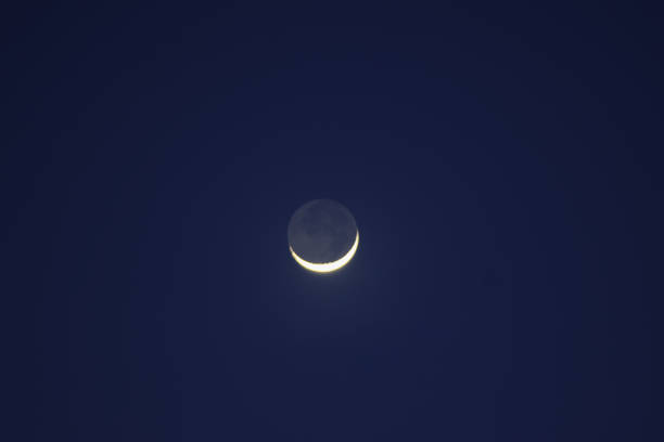 istock the moon and its half moon are shown in a dark blue sky 1919895731