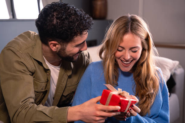 istock Valentine's Day celebration, gift giving and romantic couple concept. 1919896806