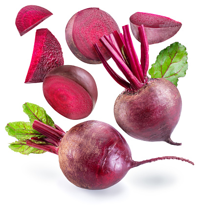 Beetroot and slices of beetroot or taproot levitating in air. File contains clipping paths.