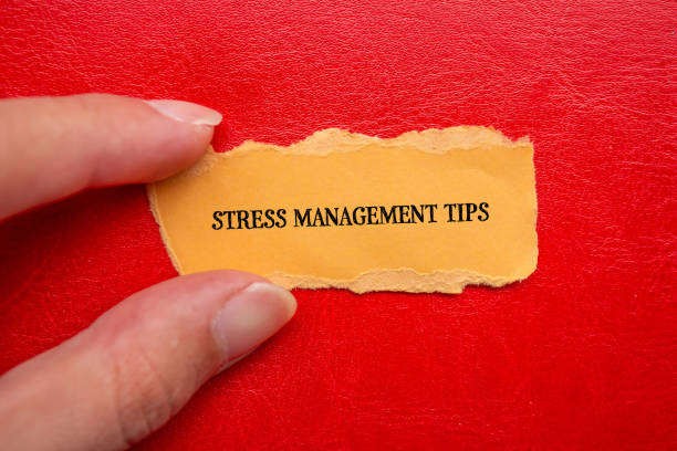 istock Stress management tips lettering on ripped orange paper piece 1919909617