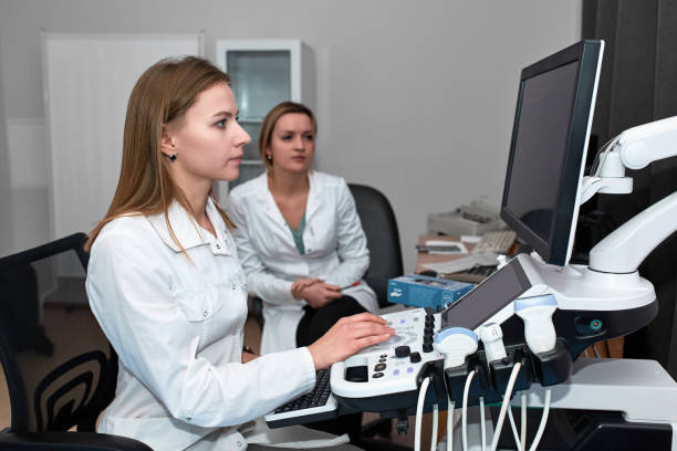 istock A girl doctor conducts ultrasound diagnostics for training an intern. Learning process. Healthcare and medicine concept 1919946617