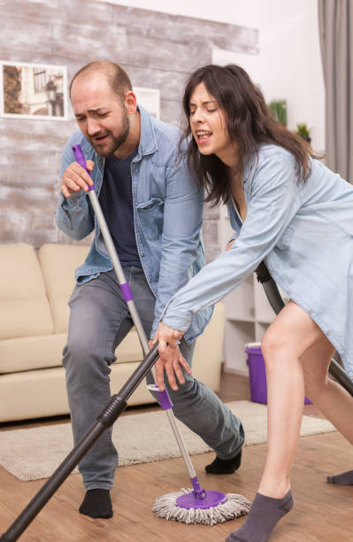 istock Boyfriend and girlfriend house cleaning 1919953497