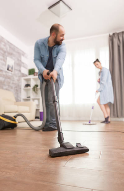 istock Boyfriend cleaning house 1919953584