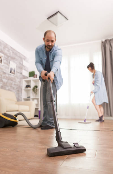 istock Cleaning floor with vacuum cleaner 1919961541