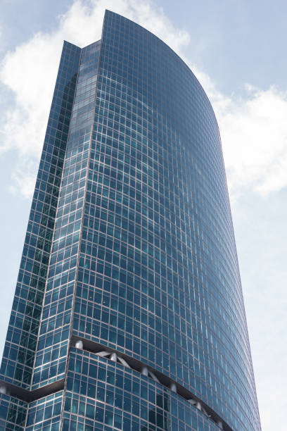 istock A tall glass business building with large windows. Architecture 1919978551