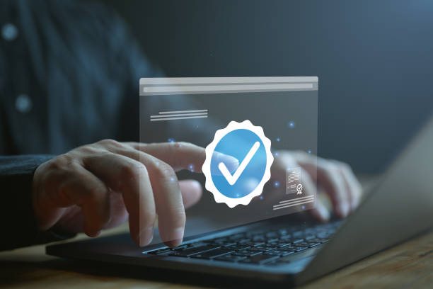 istock Businessman touch on verification account blue tick checkmark concept, verification account on social media platform, subscription status, eliminate bots and spam, cyber crime, increase credibility. 1919985481
