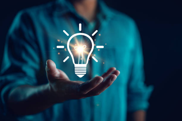 istock Creative idea. Concept of idea and innovation, Businessman holding light bulb. Idea concept with innovation and inspiration for business or education, Creative thinking and learning. 1919986021