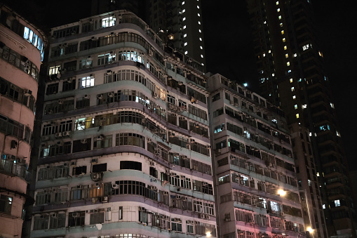 Old condominiums in Sham Shui Po district by night, Kowloon Peninsula.