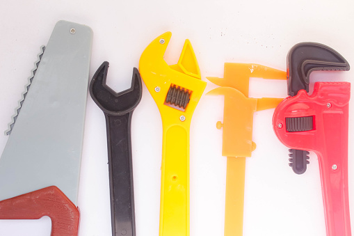 Various shapes of carpentry tools on a white background
