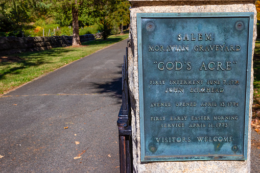 Old Salem, North Carolina, USA - October 26, 2023:  iMoravian Graveyard still known by it's Germanic name Gottesacker  translation Gods Acre.  Headstone are all the uniform shape.