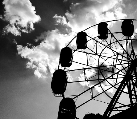 Silhouette of a Ferris wheel in the background