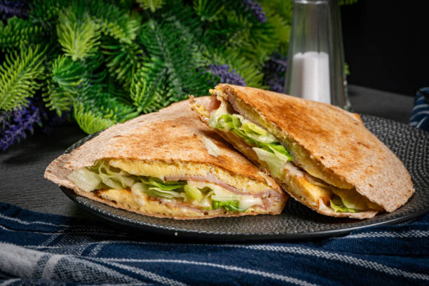 istock Tortilla multigrain with omelette, lettuce and ham. 1920026803