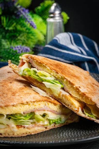 istock Tortilla multigrain with omelette, lettuce and ham. 1920027334