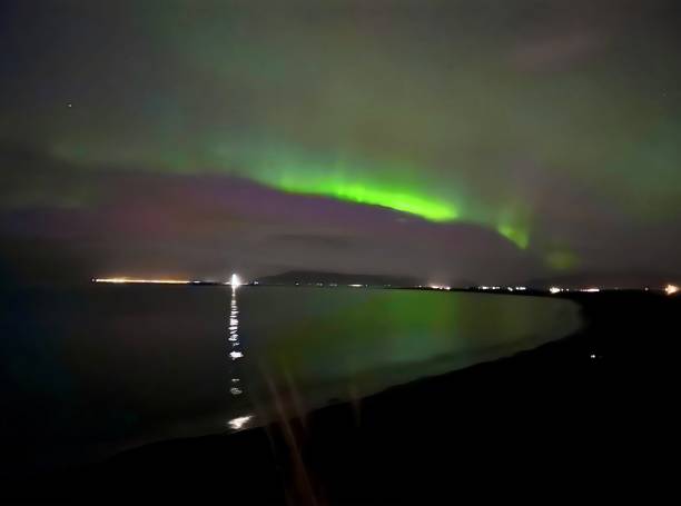 istock Bright Green and Purple Auroras above Reykjavik 1920046640