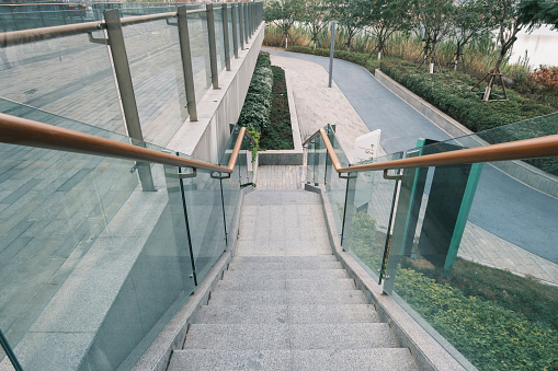 Glass handrail staircase under office building