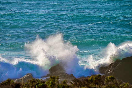 Big beautiful wave in turquoise water.