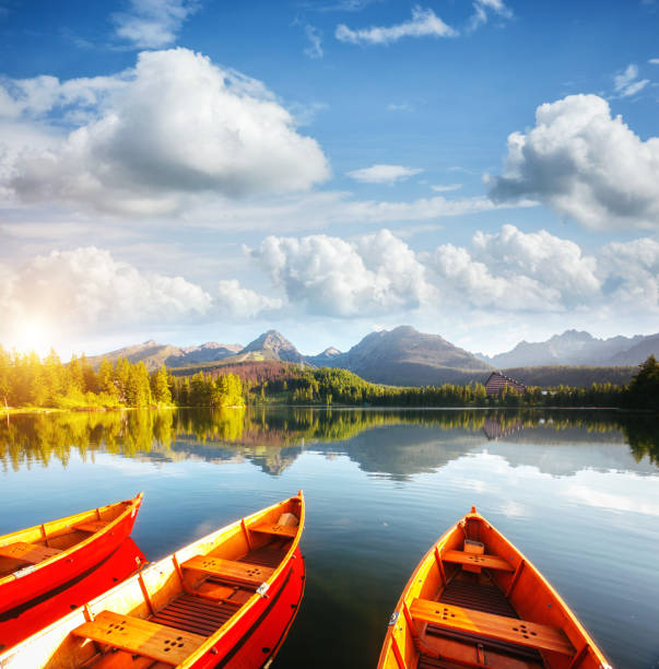 Calm mountain lake in National Park High Tatra. Location place Strbske pleso, Slovakia, Europe. Calm mountain lake in National Park High Tatra. Location place Strbske pleso, Slovakia, Europe. Scenic image of most popular european travel destination. Summer vacation. Discover the beauty of earth. pleso stock pictures, royalty-free photos & images