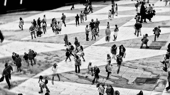 Shot of unrecognizable people walking on Sergels Torg town square. The city is Stockholm Sweden.