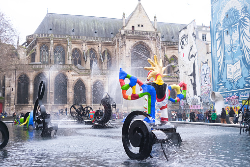 Paris, France - January 1, 2024: Stravinsky Fountain Square, with sculptures above the fountain of Le Center Pompidou.