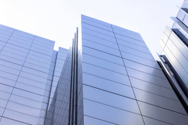 istock Low angle view of modern office building, sky background with copy space 1920133550