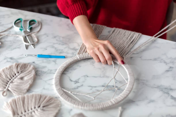 istock Woman weaves macrame. Close up 1920148141