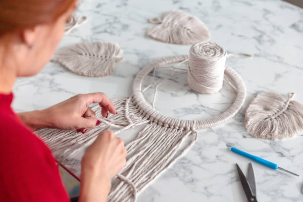 istock Woman weaves macrame. Close up 1920148629