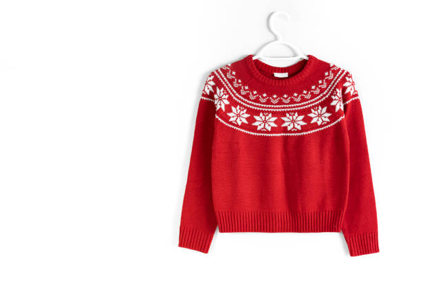 istock Beautiful red knitted christmas sweater hanging on white backgound. New year ornated pullover. Warm traditional pullover. 1920148633