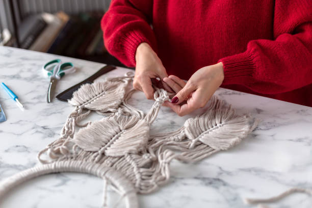 istock Woman weaves macrame. Close up 1920151224