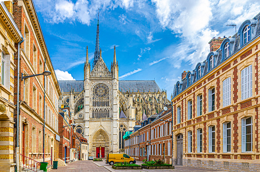 Amiens Cathedral Basilica of Our Lady Notre-Dame and pedestrian street with traditional buildings in old historical city centre, cityscape Amiens landmarks, Hauts-de-France Region, Northern France