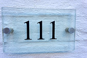 Close up of an house door number 111