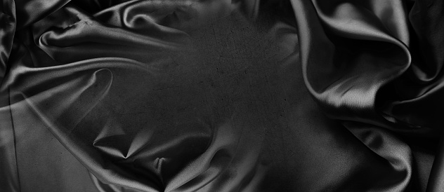 Closeup of rippled black silk fabric