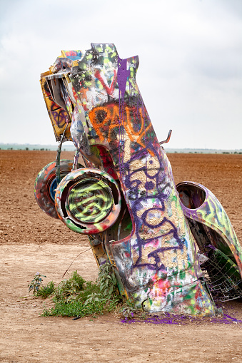 Cadillac Ranch in Amarillo, Texas, is a Route 66 landmark and iconic public art installation featuring vintage Cadillacs buried nose-down in the ground.