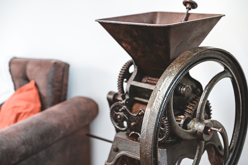 Old stylish coffee grinder on white isolated background