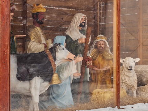 The three sages, the Virgin Mary and the animals are the cow and the lamb. Christmas scene.