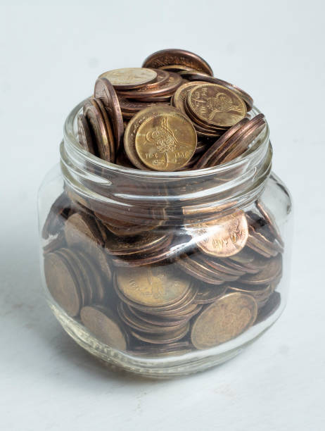istock Old Egyptian Coins in Glass Jar, Saving Concept 1920254945