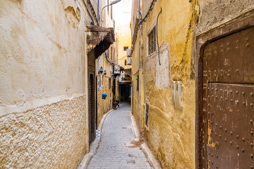 Fes, Morocco. View of the narrow and suggestive alleys in the ancient souk of the medina in Fes in Morocco