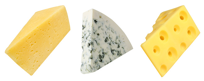 Collection of pieces of cheeses on an isolated white background. Blue cheese, Maasdam